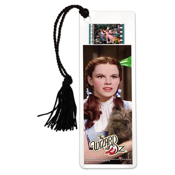 A laminated bookmark featuring a photograph of Judy Garland as Dorothy Gale with a 35mm film clip, adorned with a classic style tassel.